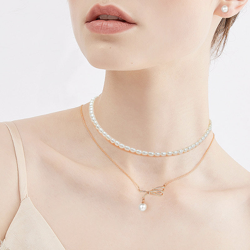 Crystal Bow Pearl Pendant Necklace – Silver