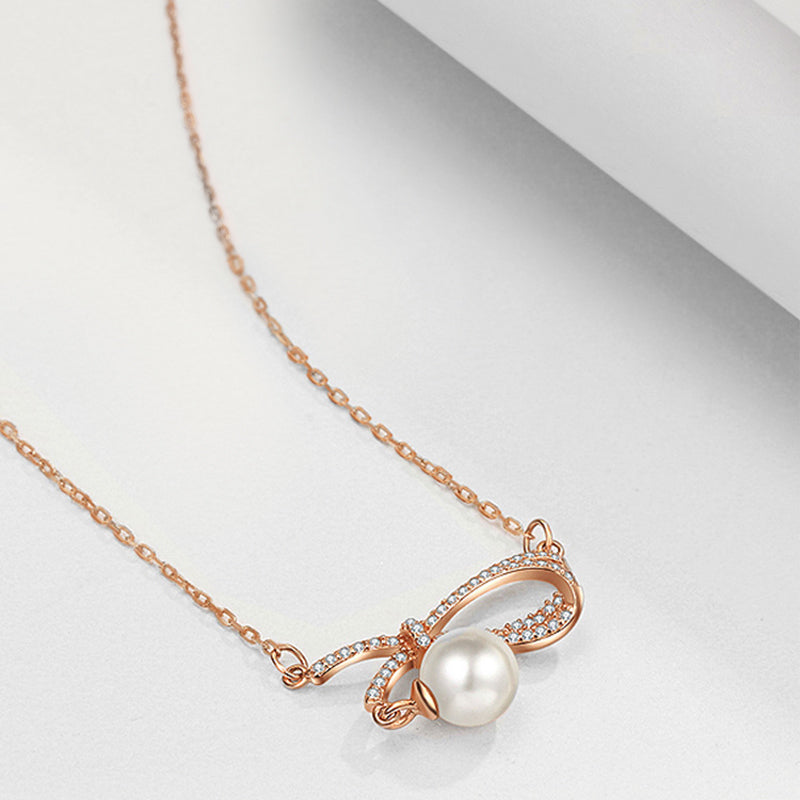 Crystal Bow Pearl Pendant Necklace – Silver